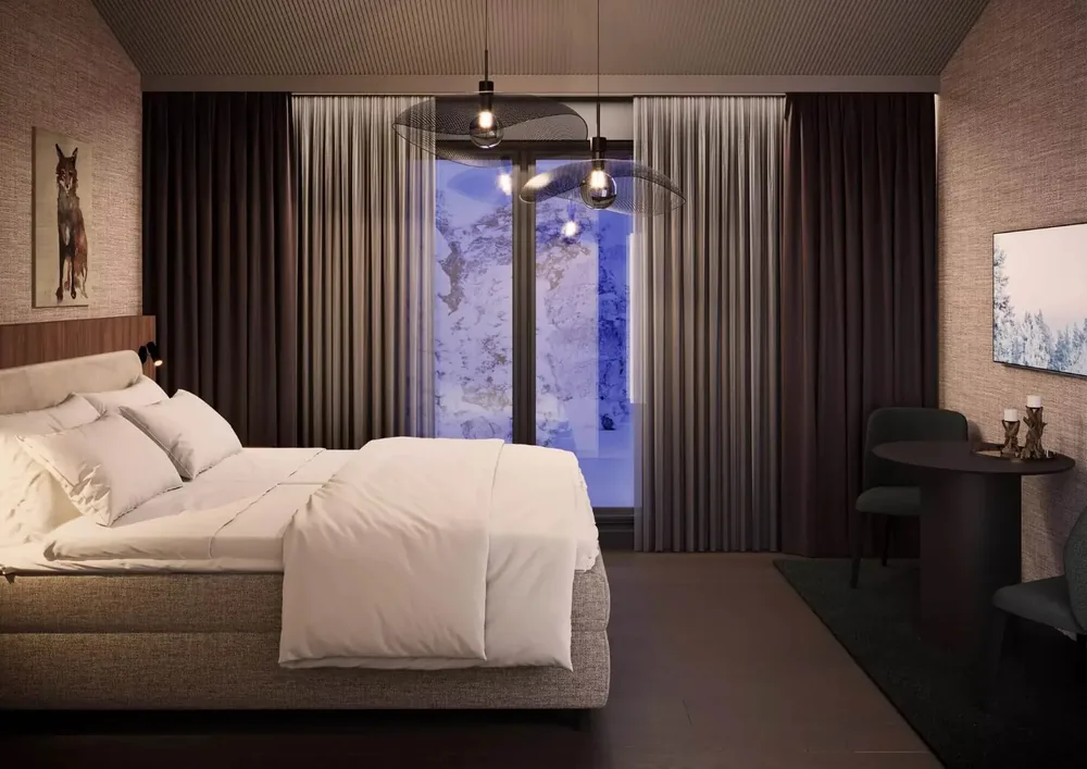 A quiet Kuru room at Hotel Kuura with snow visible beyond the window