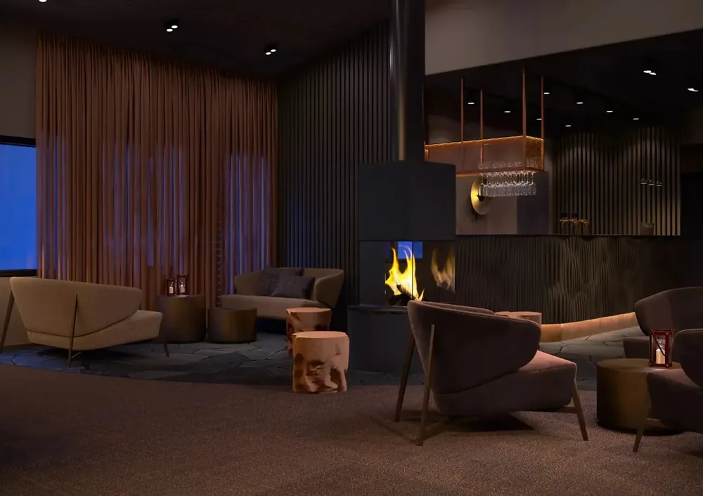 Kuura lounge arranged around a lit fireplace